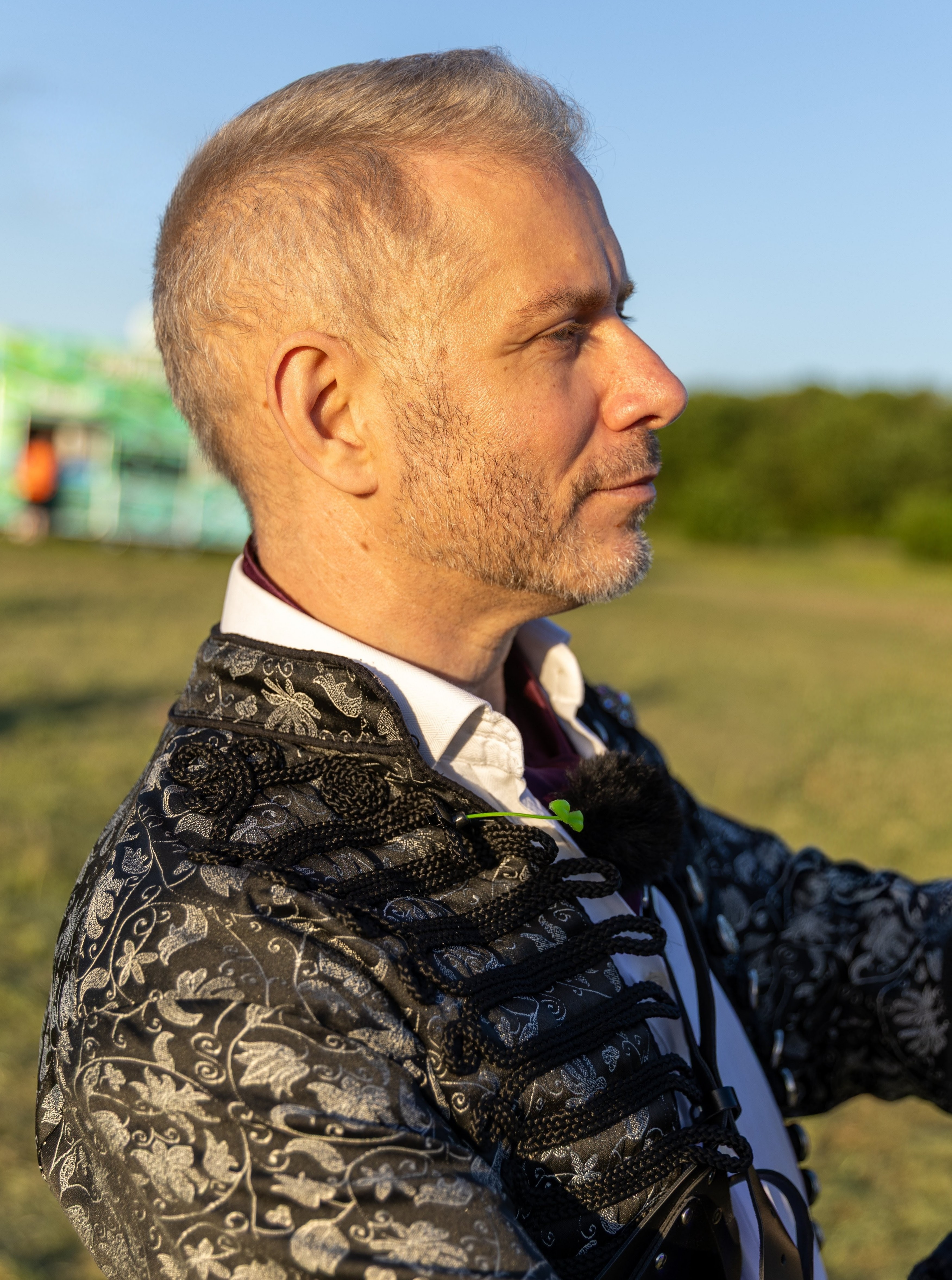 A picture of Finbarre Snarey at a festival, watching a performance