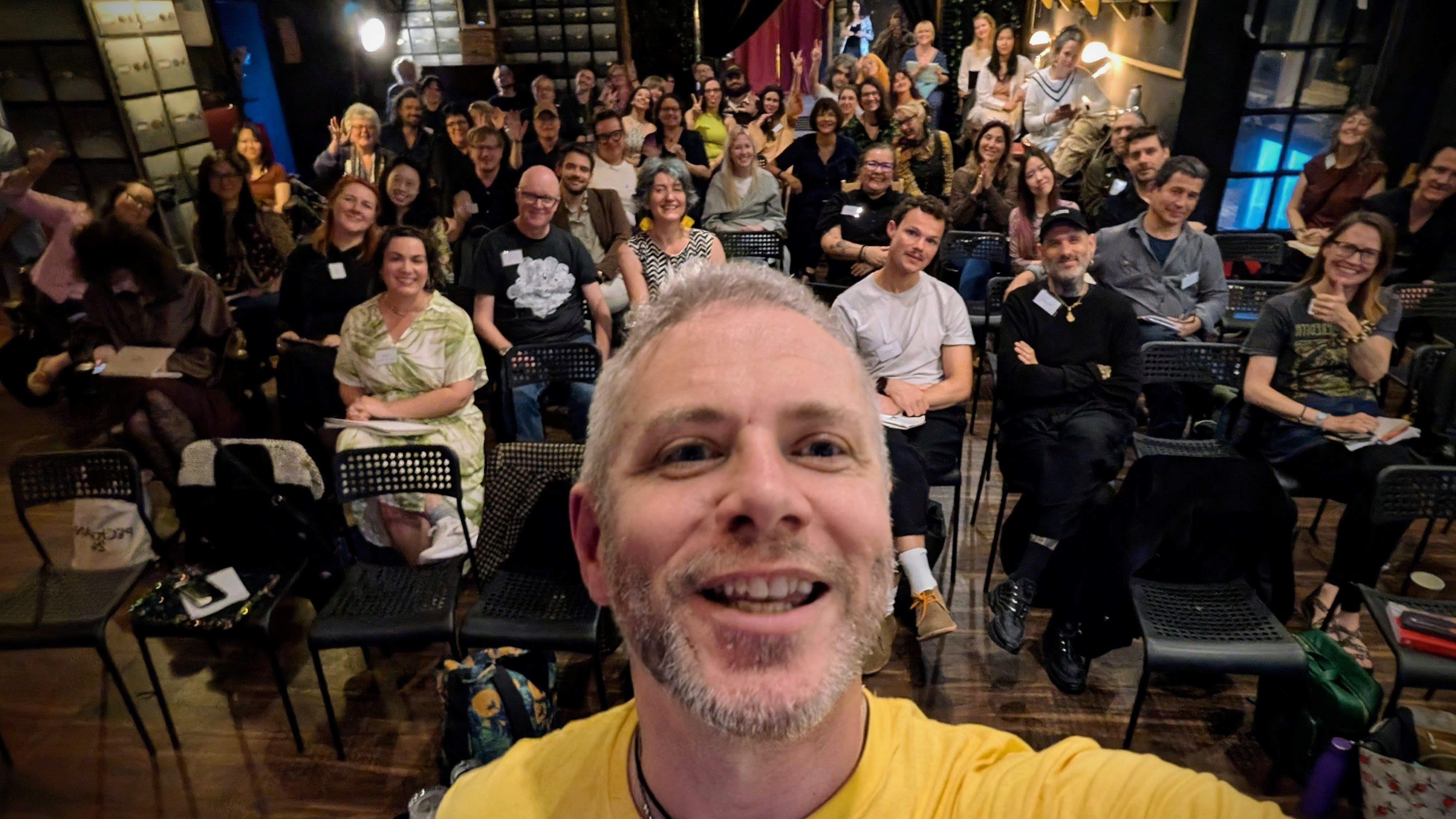 Finbarre Snarey takes a selfie in front of a packed audience at Tarot Cultures, a conference organised by Goldsmiths, University of London, after presenting his paper on Rider-Waite-Smith tarot reading as living heritage.