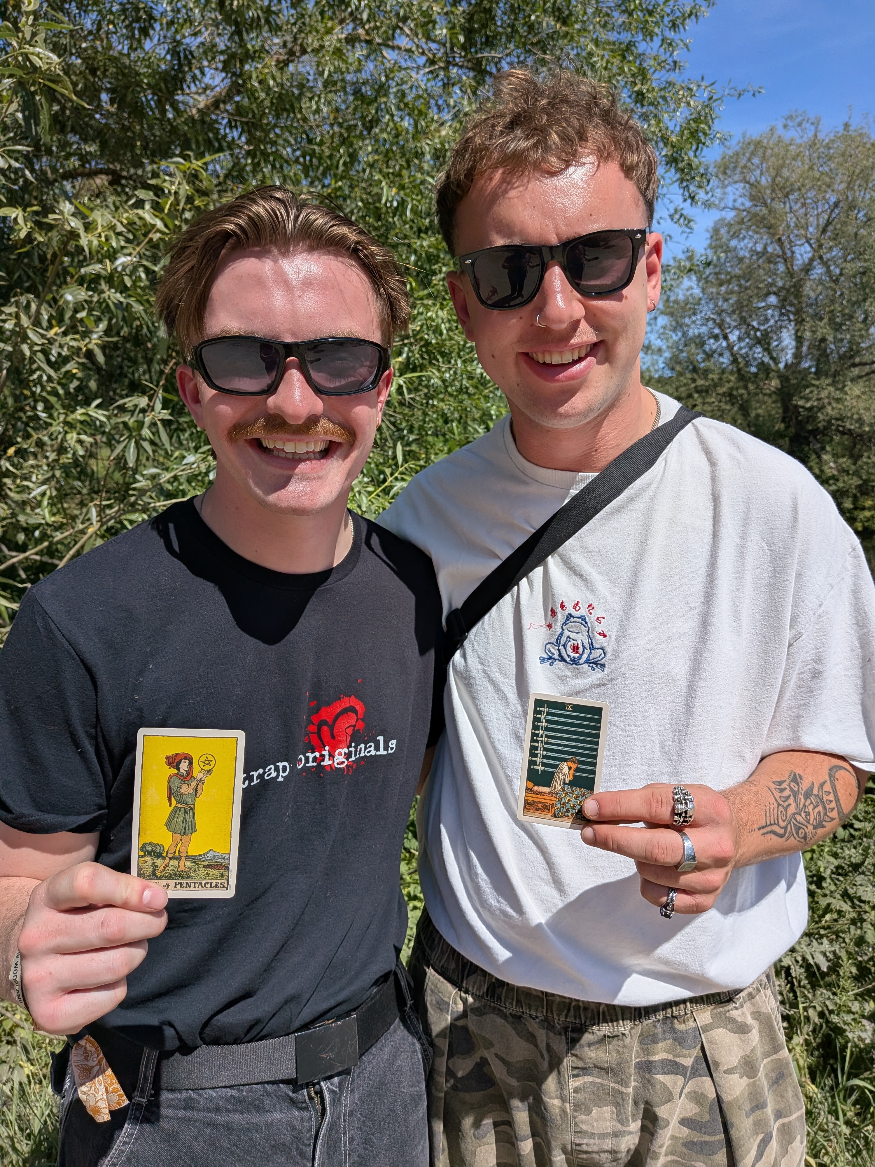 The band members of GANS taking part in a Tarot Interviews recording at an outdoor event.