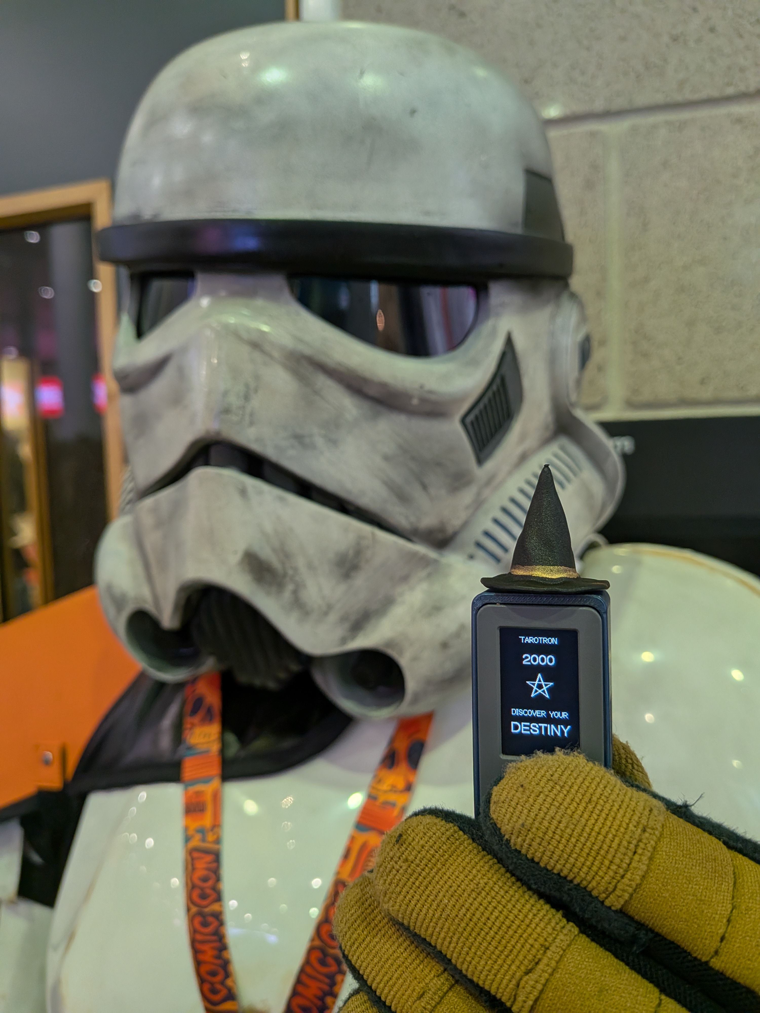 TAROTRON 2000 meets a Stormtrooper at MCM London Comic Con 2026. Star Wars cosplay meets a miniature electronic tarot machine in this convention encounter.
